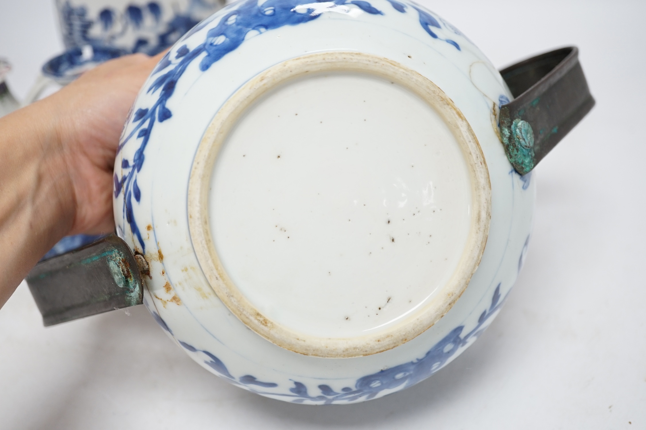 A group of five 18th century Chinese export ceramics to include a rare blue and white ‘dragon’ chamberstick, tallest 16cm. Condition - poor